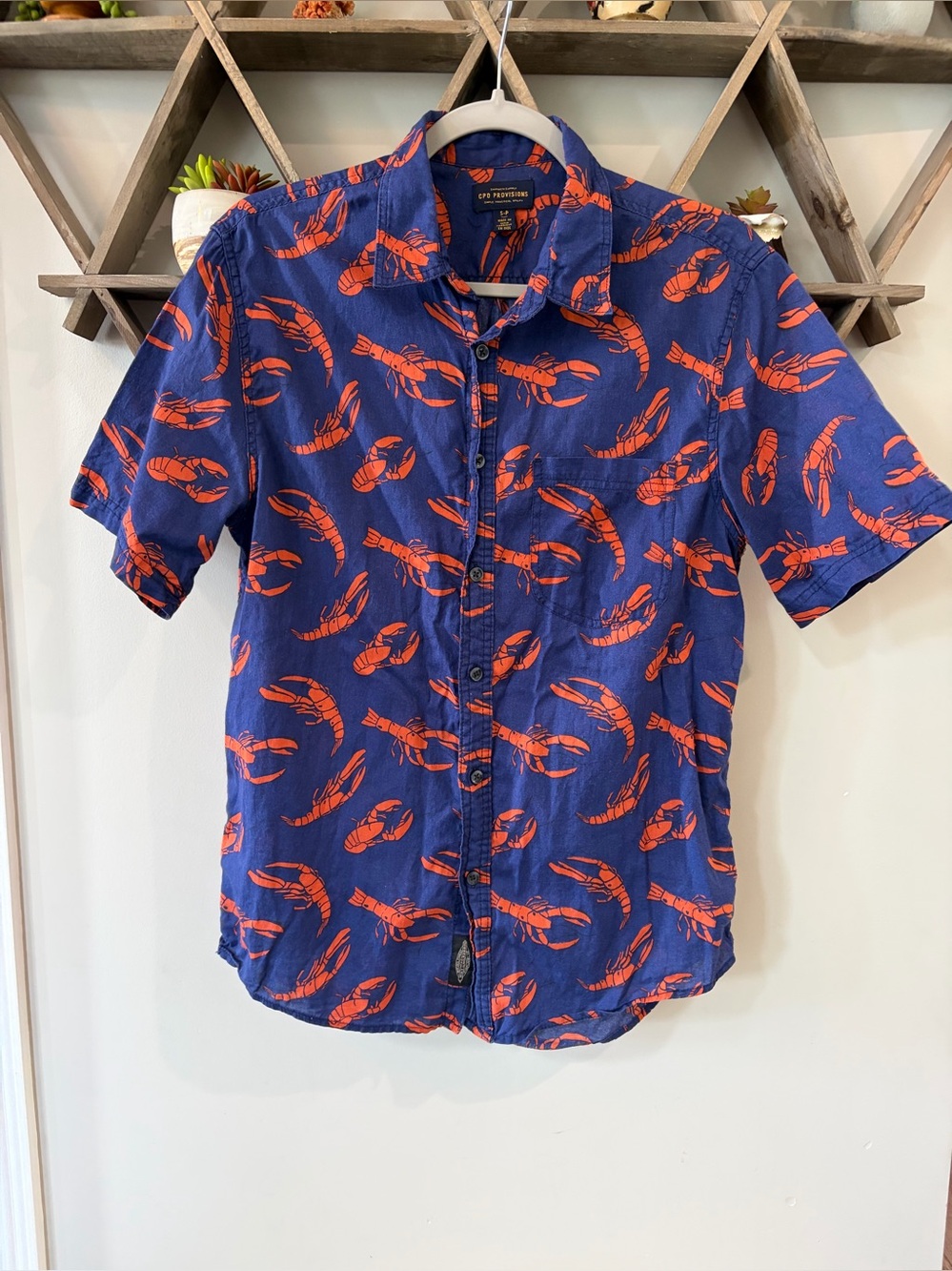 Men’s Urban Outfitters
CPO Provisions lobster button down shirt. Size Small